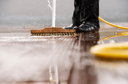 Vivid detail of a srubbing brush outdoors with sparkling water