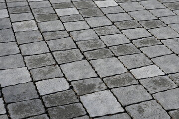 gray paving slabs as a background, pavement paved slabs as a background