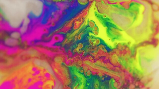 Paint mix in water. Color fluid. Liquid ink texture. Vibrant pink yellow blue acrylic bubble dye blend flow motion creative art abstract background.