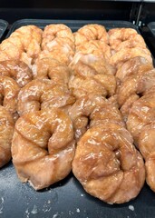 Fried, glazed crescent rolls for sale