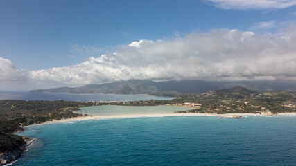 Fototapeta na wymiar Aerial image of the sea of ​​Sardinia, Villasimius. Crystal clear sea and clouds