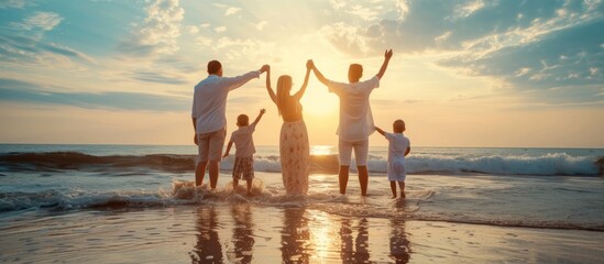 Serene family enjoying beautiful sunset beach together in the ocean