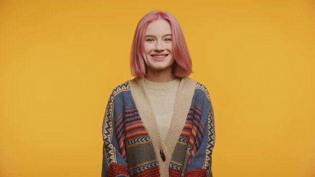 Woman Nodding Head in Agreement Isolated on Yellow
