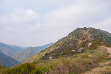 Views while gravel biking in the Santa Monica Mountains on Sullivan Ridge during an overcast day.