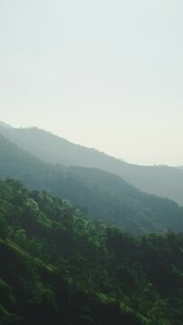Vertical video. Beautiful misty valleys. Scenic mountain landscape.