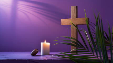 Wooden cross, candle and palm leaves on purple background