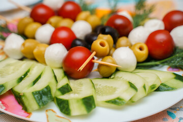 A plate of appetizers vegetables and olives