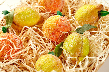 Assorted fruit-shaped shortcrust pastries in straw basket