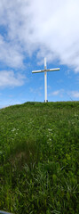 Panoramic image of the White Cross on the Hilltop at the Mont Joli Lookout in Perce on the Gaspe Peninsula on the Gulf of St. Lawrence in Quebec Canada