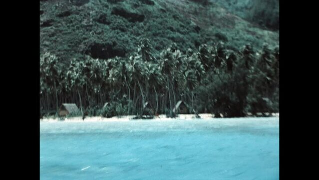 Island Homes on Moorea-Maiao 1971 - Moorea-Maiao, in French Polynesia near Tahiti, are seen from an outrigger boat traveling off shore in 1971. 