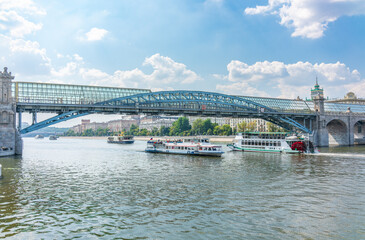 Obraz premium View of the Moscow river embakment, Pushkinsky bridge and cruise ships at sunset.
