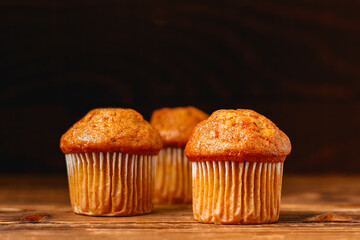 Carrot mini muffins on rustic wood