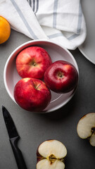 red apple and knife on the table