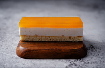 Mango and mousse cream cake in a plate