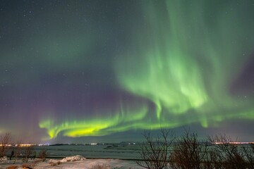 scenic view of aurora borealis over Iceland