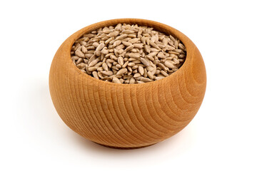 Peeled sunflower seeds in wooden bowl, isolated on white background.