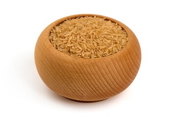 Raw brown rice in wooden bowl, isolated on white background.