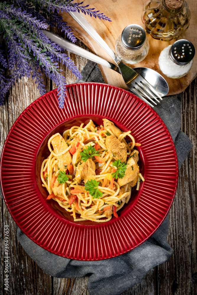 Wall mural fried noodles with chicken and vegetables.