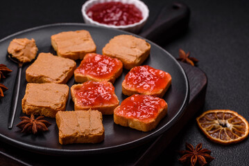 Delicious nutritious sandwiches with peanut butter, strawberry jam