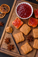 Delicious nutritious sandwiches with peanut butter, strawberry jam