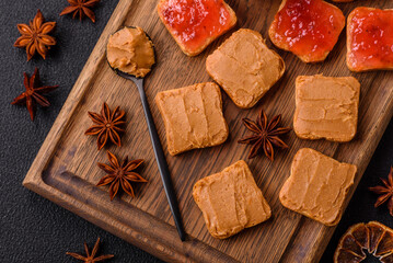 Delicious nutritious sandwiches with peanut butter, strawberry jam