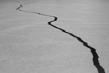 Abstract Crack in the Ice of Weissensee Lake in Carinthia, Austria Black and White