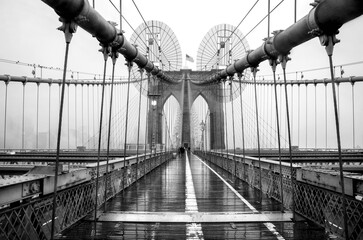 Brooklyn bridge, New York City. USA. New York in a foggy day in downtown Manhattan. Black and white...