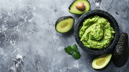 Creamy guacamole accompanied by ripe avocado halves and lime, showcasing the simplicity of its ingredients. The focus on the mortar emphasizes the handcrafted nature of the dish.