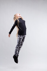Girl's graceful jump embodies freedom, childhood lightness