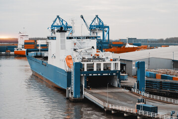 RORO Ship Loading Process In The Trade Port. Opened Rear Hydraulic Ramp During Cargo Operations