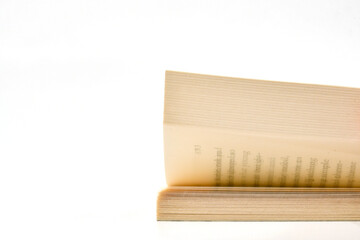 Pages of a book turning against a plan white background. Copy space.