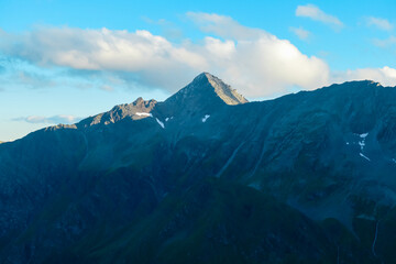 Panoramic sunset view of majestic mountain peak Boeseck in High Tauern National Park, Salzburg...