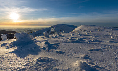 View of winter mountain landscape at sunset, the Giant mountains.