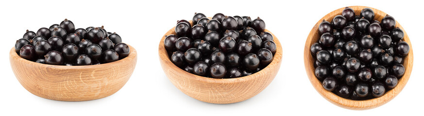 black currant in wooden bowl isolated on white background. macro. clipping path