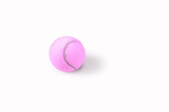 Pink tennis ball with shadow on a white  background. Simple stop motion sport animation