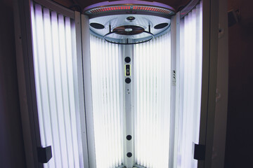 Vertical Tanning turbo Solarium Light Machine with glowing blue light ultraviolet lamps for tanning...