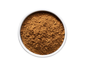 cinnamon powder in a ceramic bowl isolated on a white background, top view.