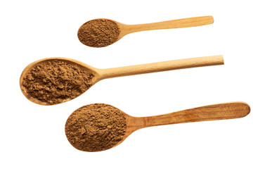 large and small wooden spoons filled with cinnamon powder isolated on a white background, top view.