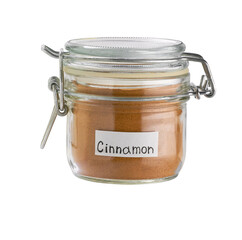 Cinnamon powder in a glass jar isolated on a white background.