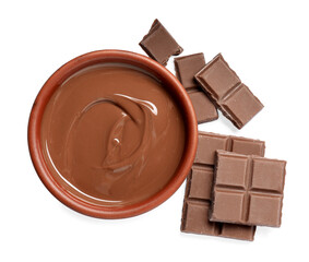 Tasty milk chocolate paste in bowl and pieces isolated on white, top view