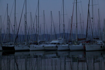 yachts in marina at blue hour twilight 