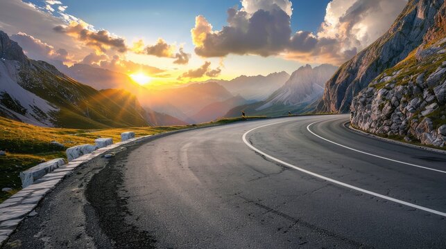 Mountain road at colorful sunset in summer. Dolomites, Italy. Beautiful curved roadway, rocks, stones, blue sky with clouds. Landscape with empty highway through the mountain pass in spring. Travel