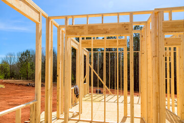 Wood stick frame framing beams in newly constructed house