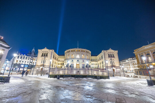 Parliament building in Oslo, Norway, on a cold winter night. Nightscape photo in oslo, ice and snow on the ground in front of Parliament.