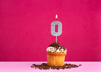 Birthday cupcake with candle number 0 - Birthday card on pink background