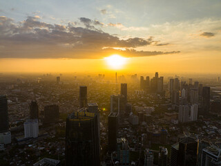 Fototapeta premium Jakarta city and skyscrapers at sunset. Urban landscape. Indonesia.