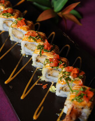 Ebi Tempura Roll served on a black wooden plate, avocado, cucumber, lump crab meat, sushi menu, social media post, food photography, fine dining, Japanese food, purple background