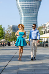 Nice looking couple walking down the street