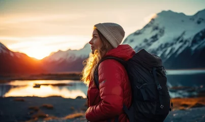 Photo sur Plexiglas Aoraki/Mount Cook Winter Wonderland Expedition: A Happy Tourist Woman, Back View, Immerses Herself in the Tranquility of a Glacier Lake, Aoraki/Mount Cook, and the Southern Alps under the Majestic Sunset Sky in Winter