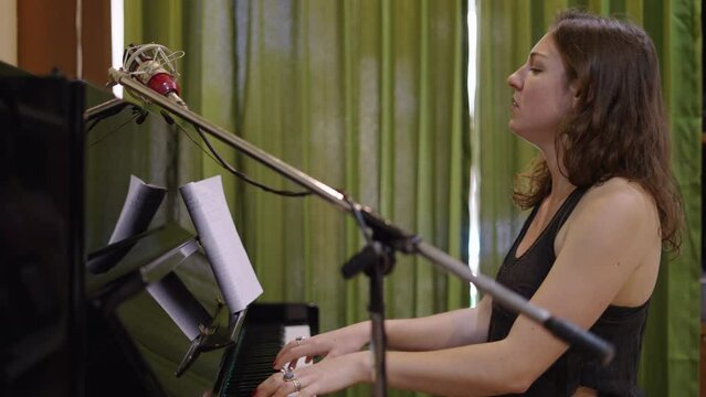 Gorgeous western woman plays the piano passionately